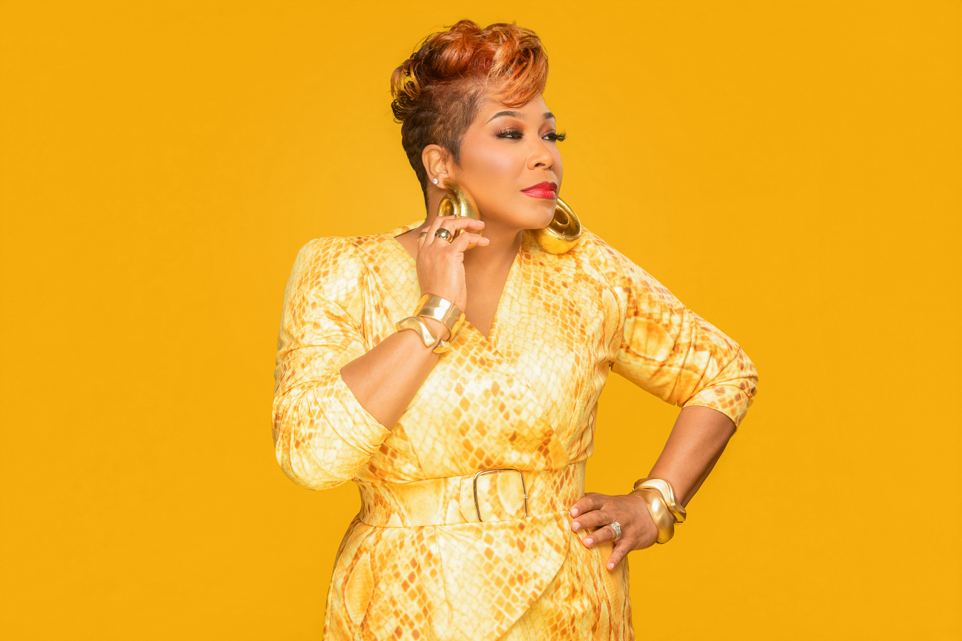 Pastor Daniella Coffey in side profile wearing gold